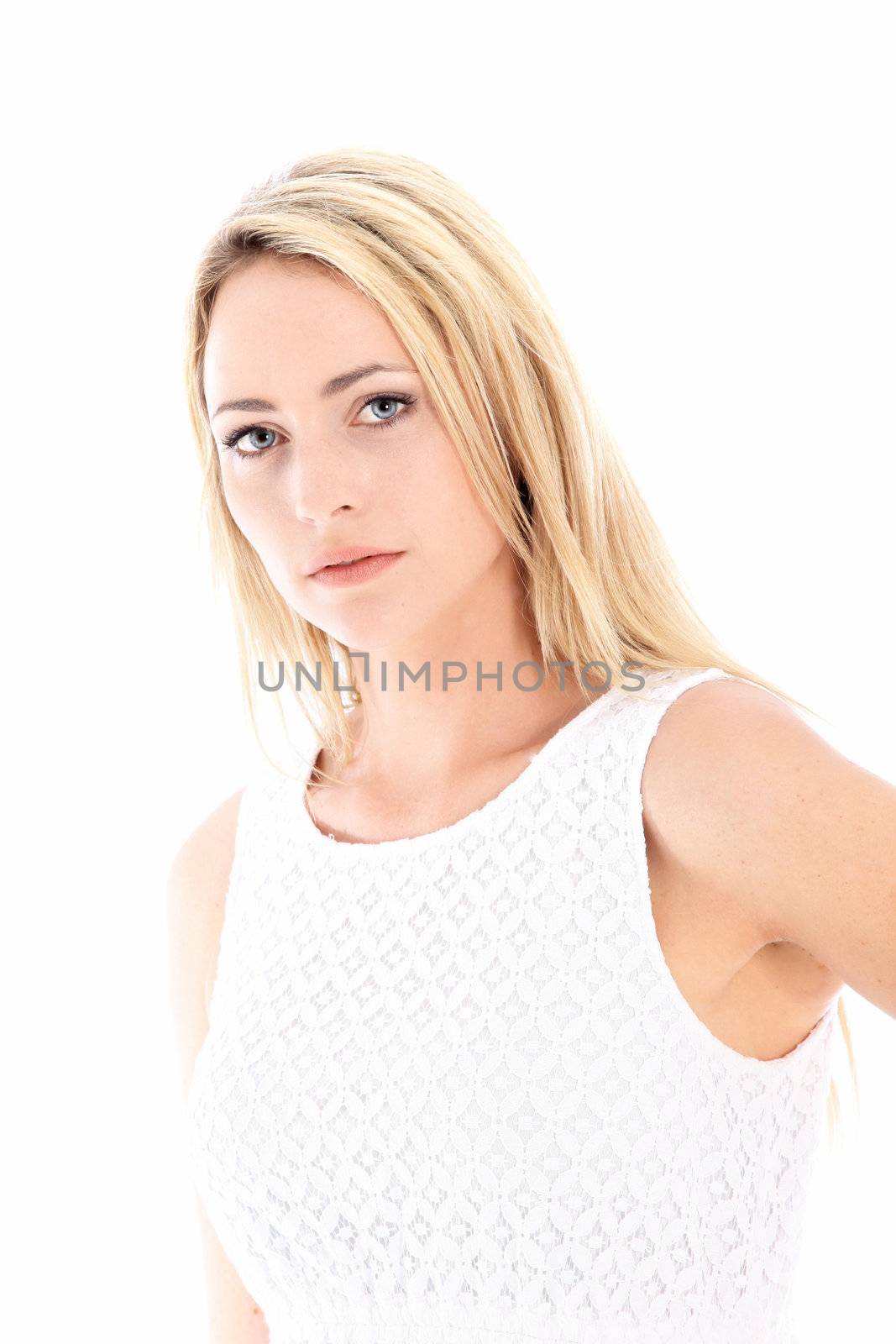 Beautiful sorrowful woman with a doleful serious expression isolated on white 