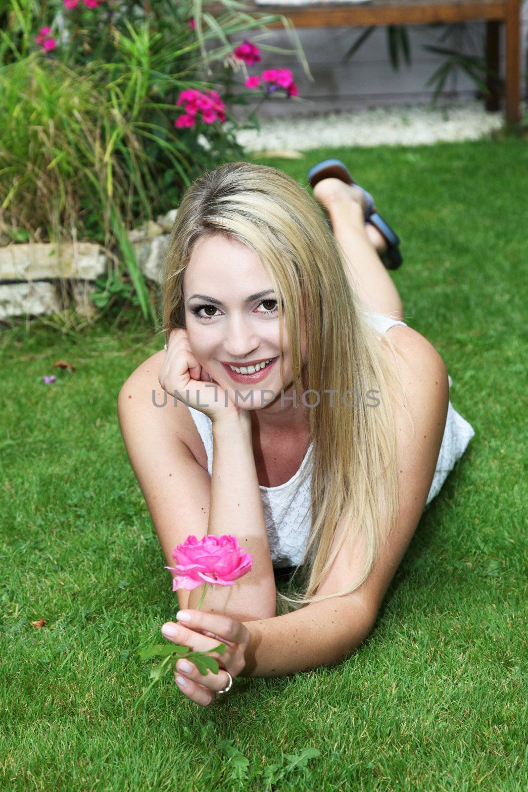 Attractive woman with pink rose Attractive woman with pink rose by Farina6000