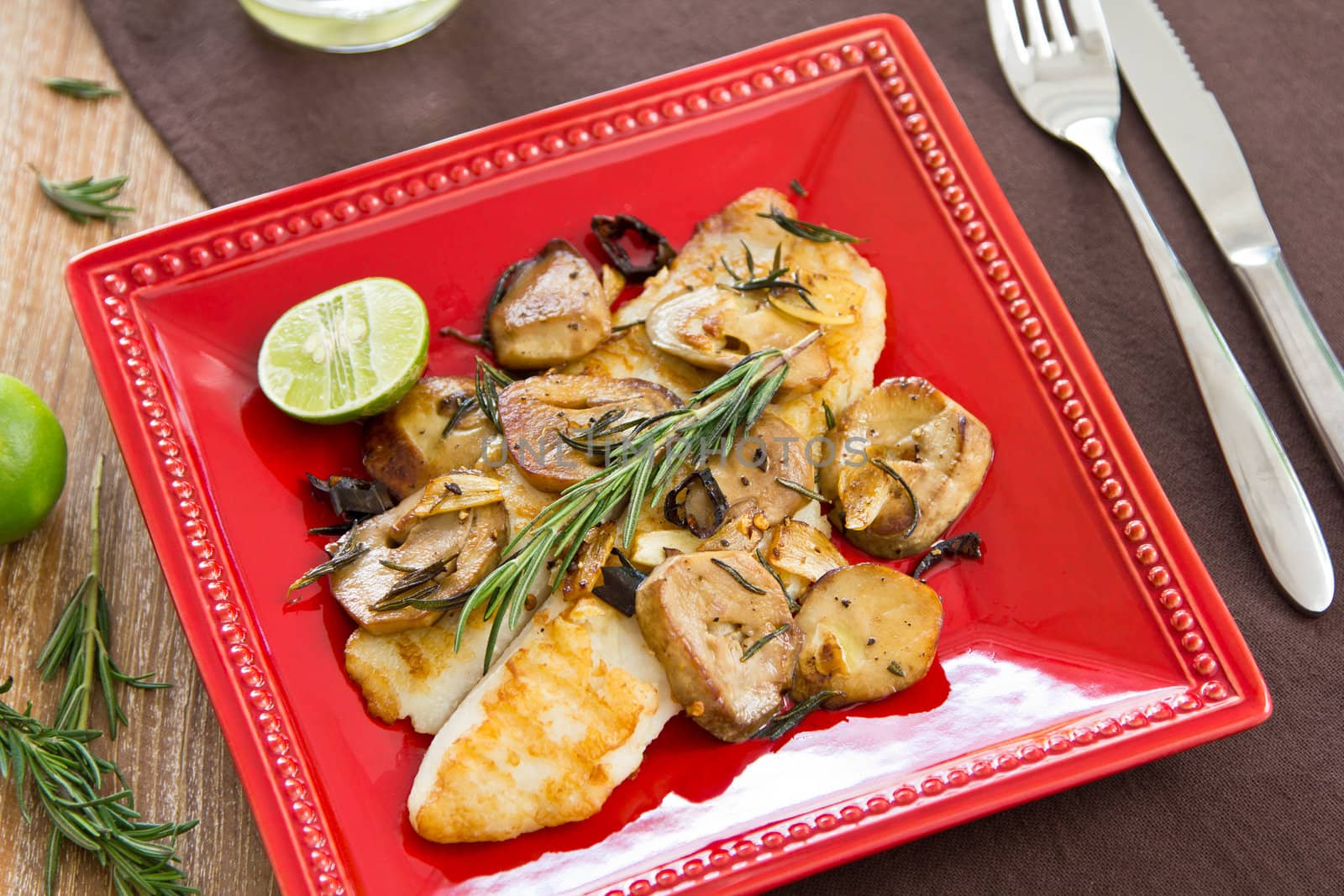 Grilled Dory fish with mushroom sautéed with  rosemary