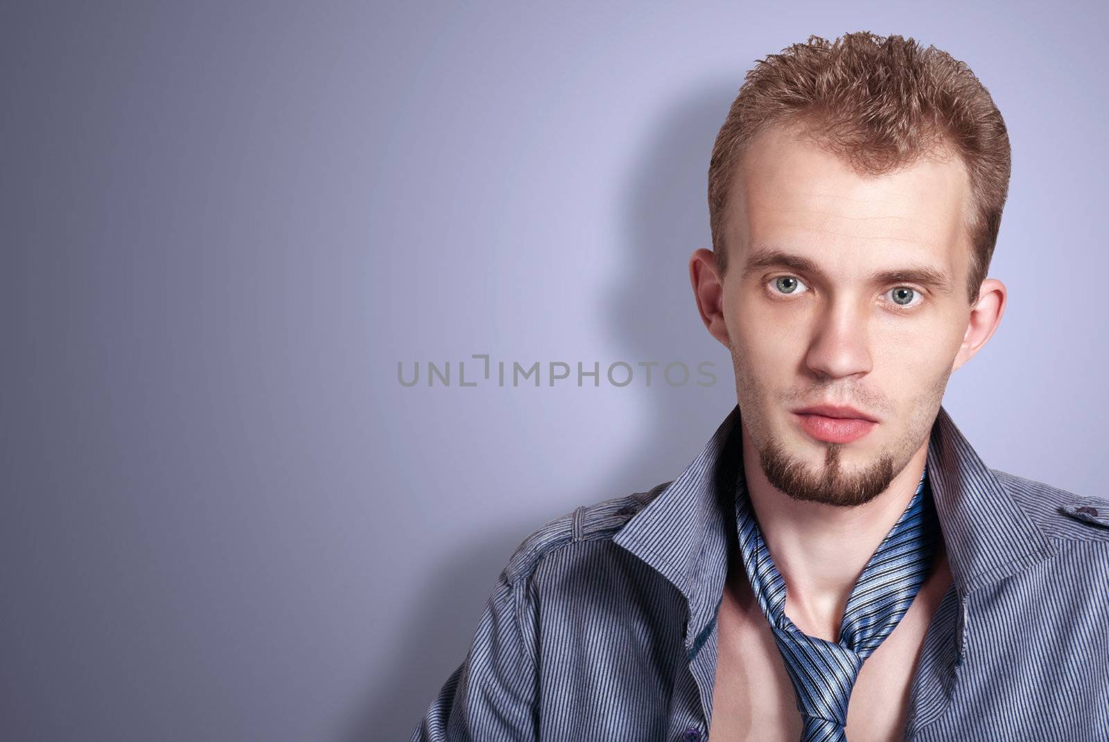 Portrait handsome fashion man in shirt and tie. Studio fashion shoot