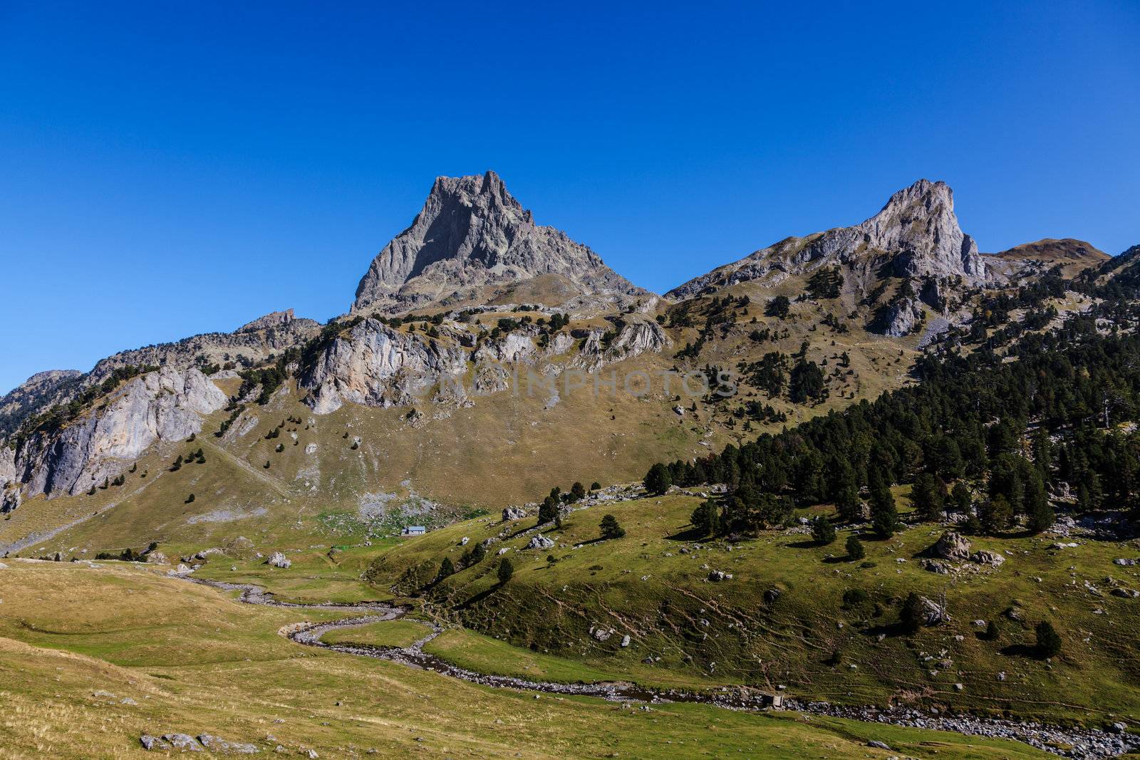 Landscape in Pyrenees Mountians in Ossau Valley with Pic du Midid D'Ossau(2884m) summit in the distance.