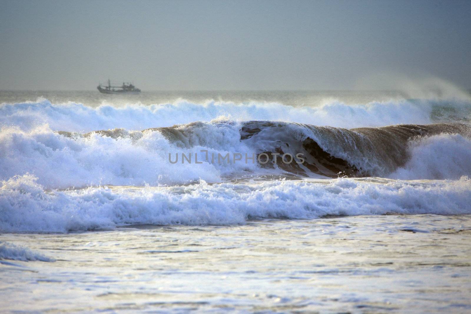 Big wave crashes on to the shore. Indian ocean
