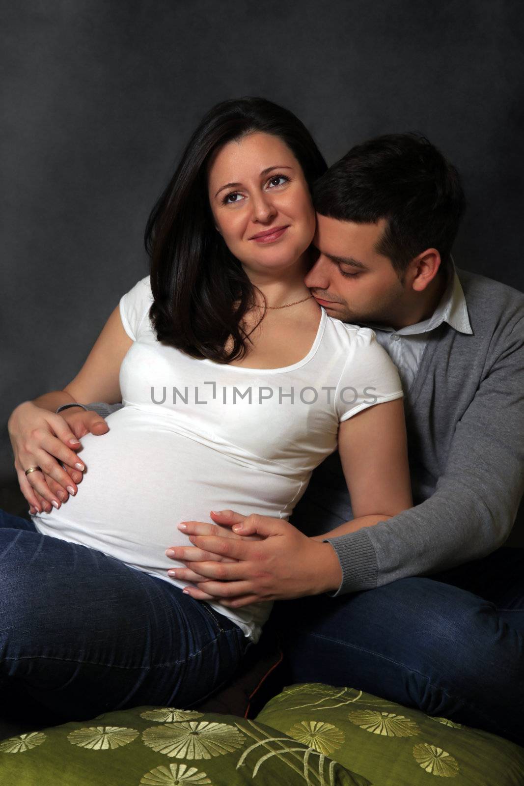 Portrait of happy daddy and his pregnant wife