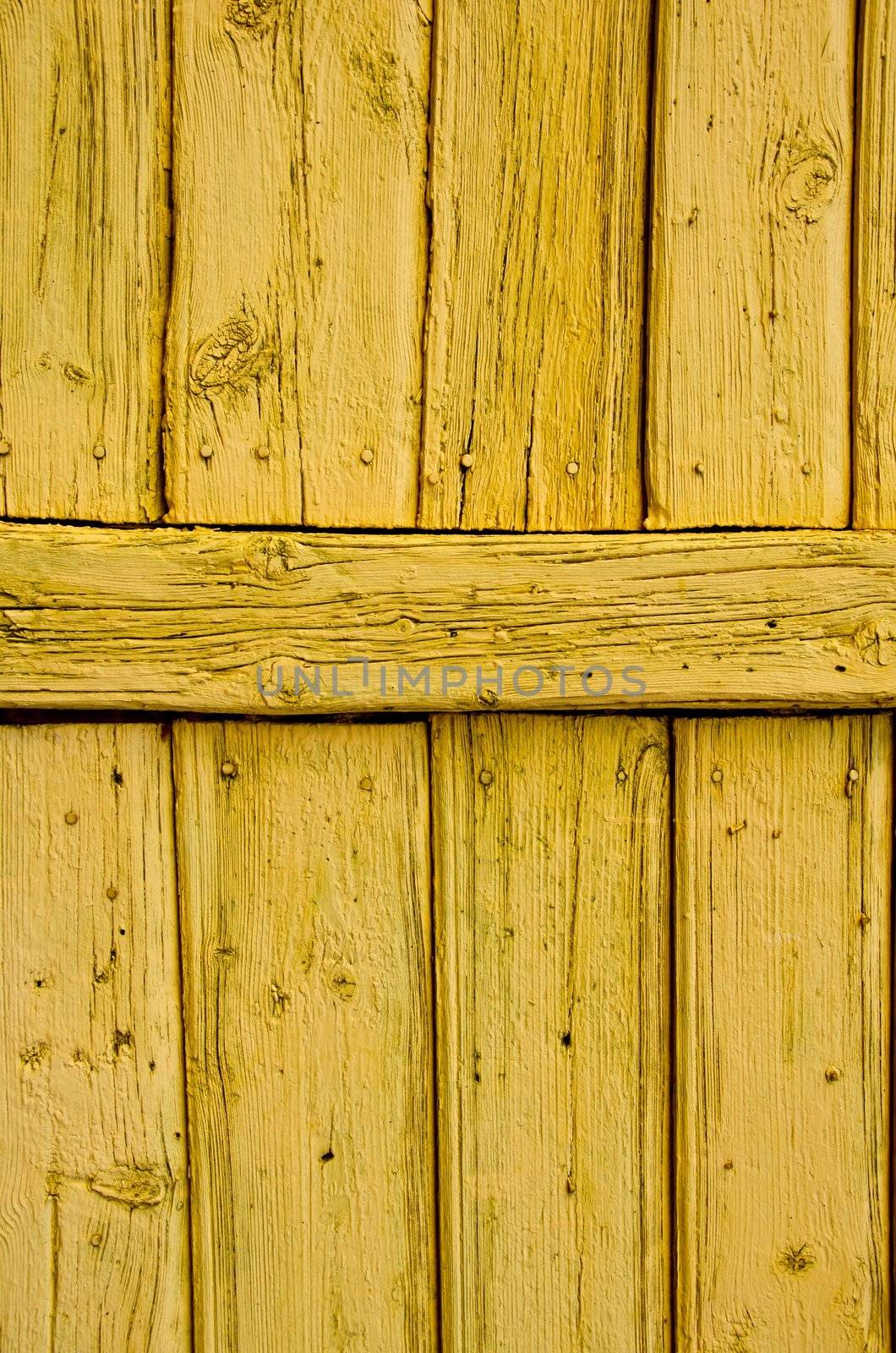 Old wooden painted wall architectural backdrop. Nails and old boards.