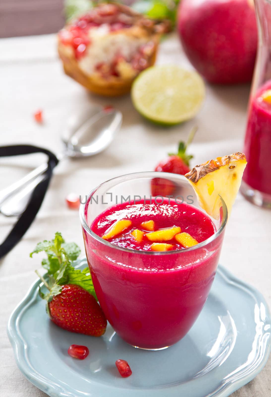 Beetroot,Mango,pineapple and pomegranate smoothie with mint