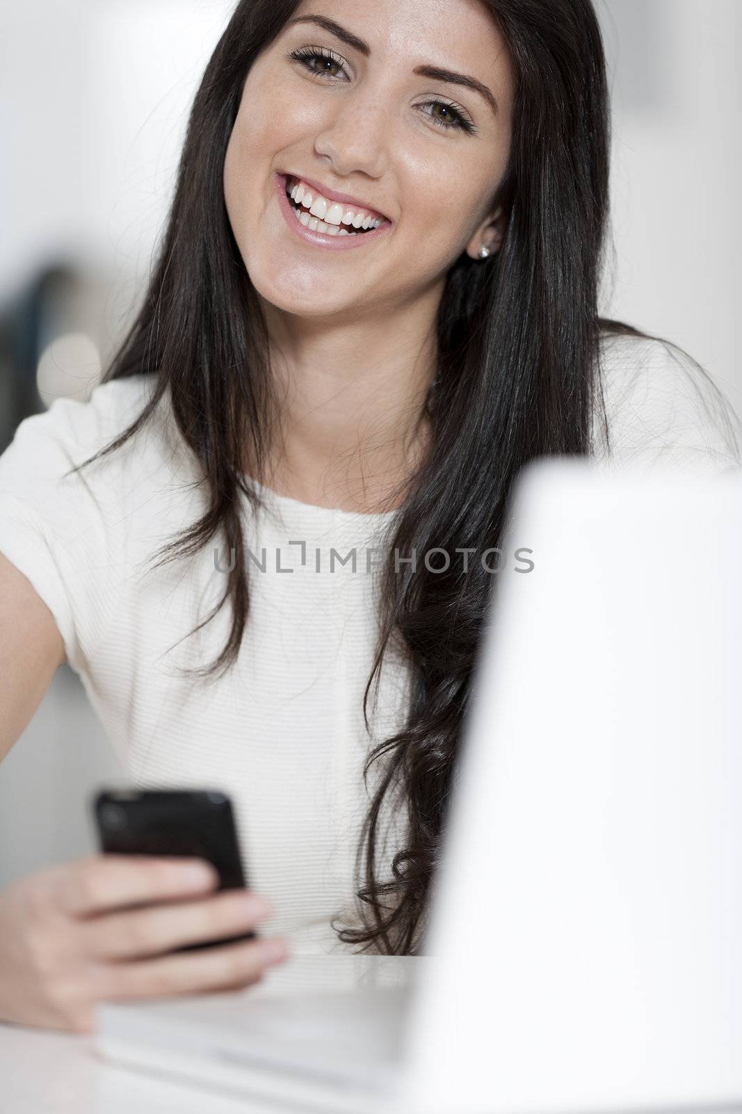 Young woman working at her desk in the office