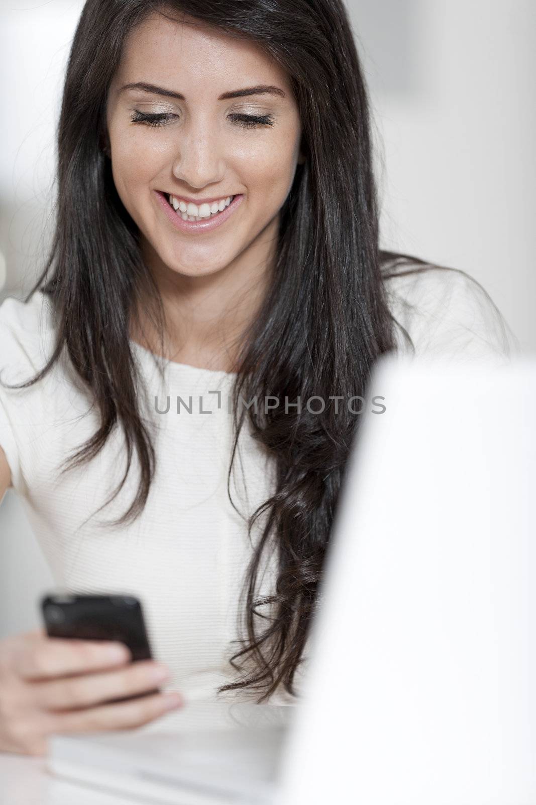 Young woman working at her desk in the office