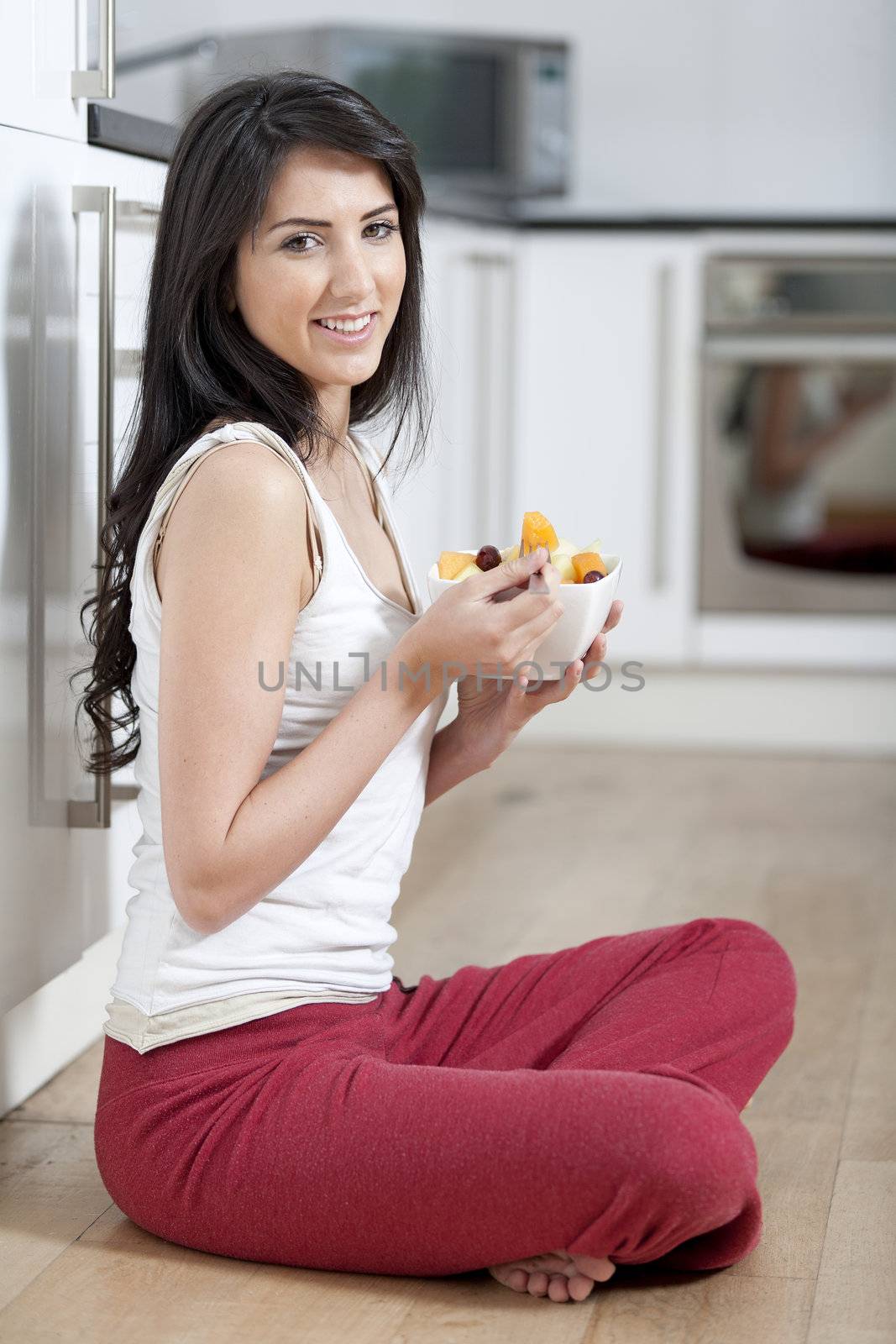 Young woman enjoying breakfast by studiofi