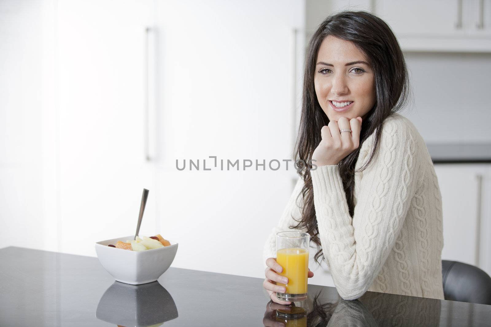 Young woman enjoying breakfast by studiofi