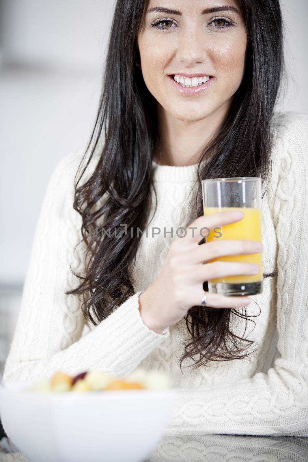 Young woman enjoying breakfast by studiofi