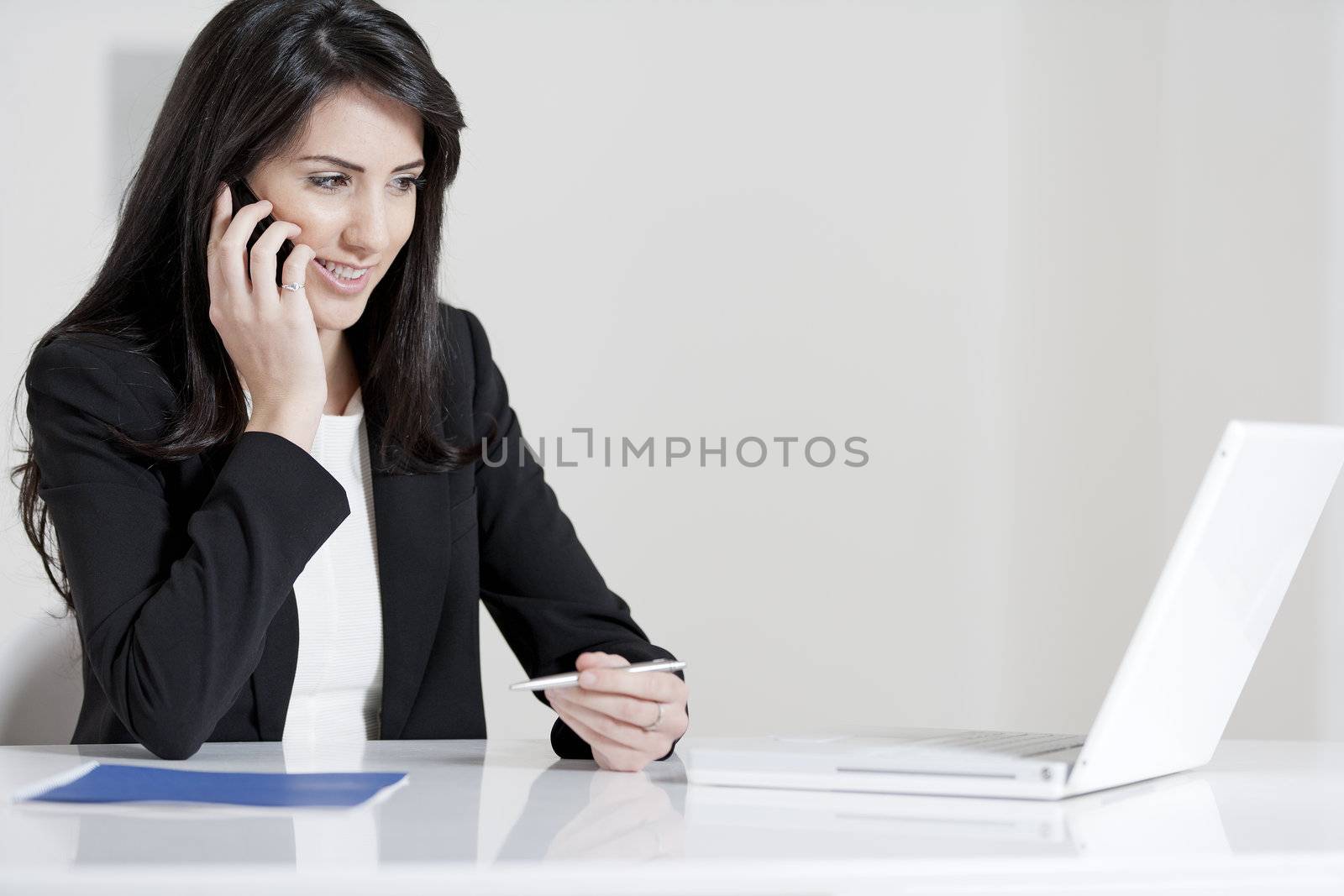 Young woman working at her desk in the office