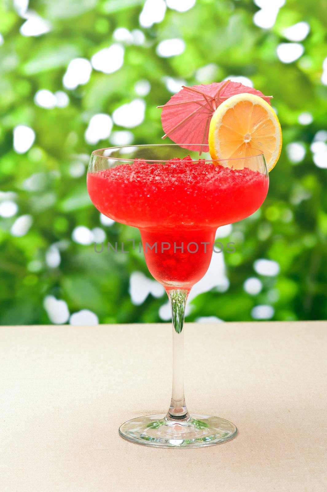 Strawberry Watermelon Daiquiri decorated with lemon and umbrella