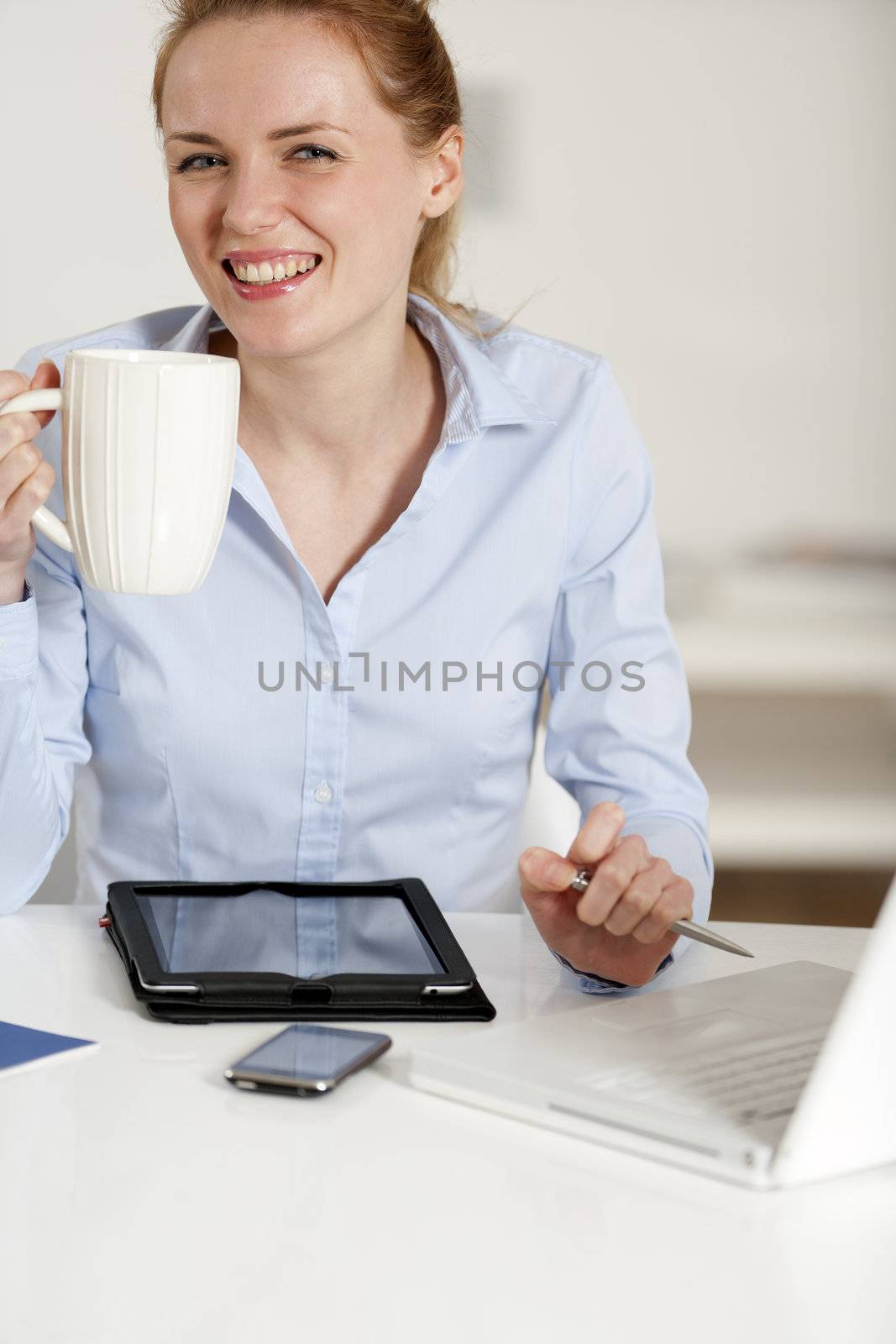 Young woman working at her desk in the office