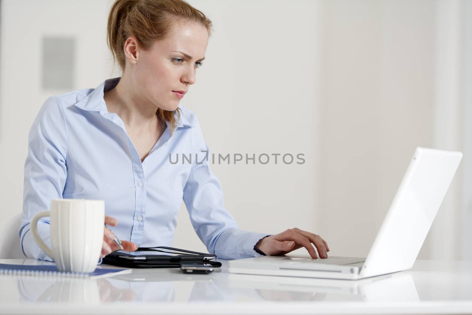 Young woman in business by studiofi