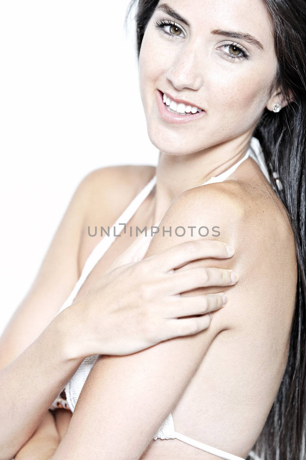 Beautiful sexy woman in white bikini smiling and cheerful