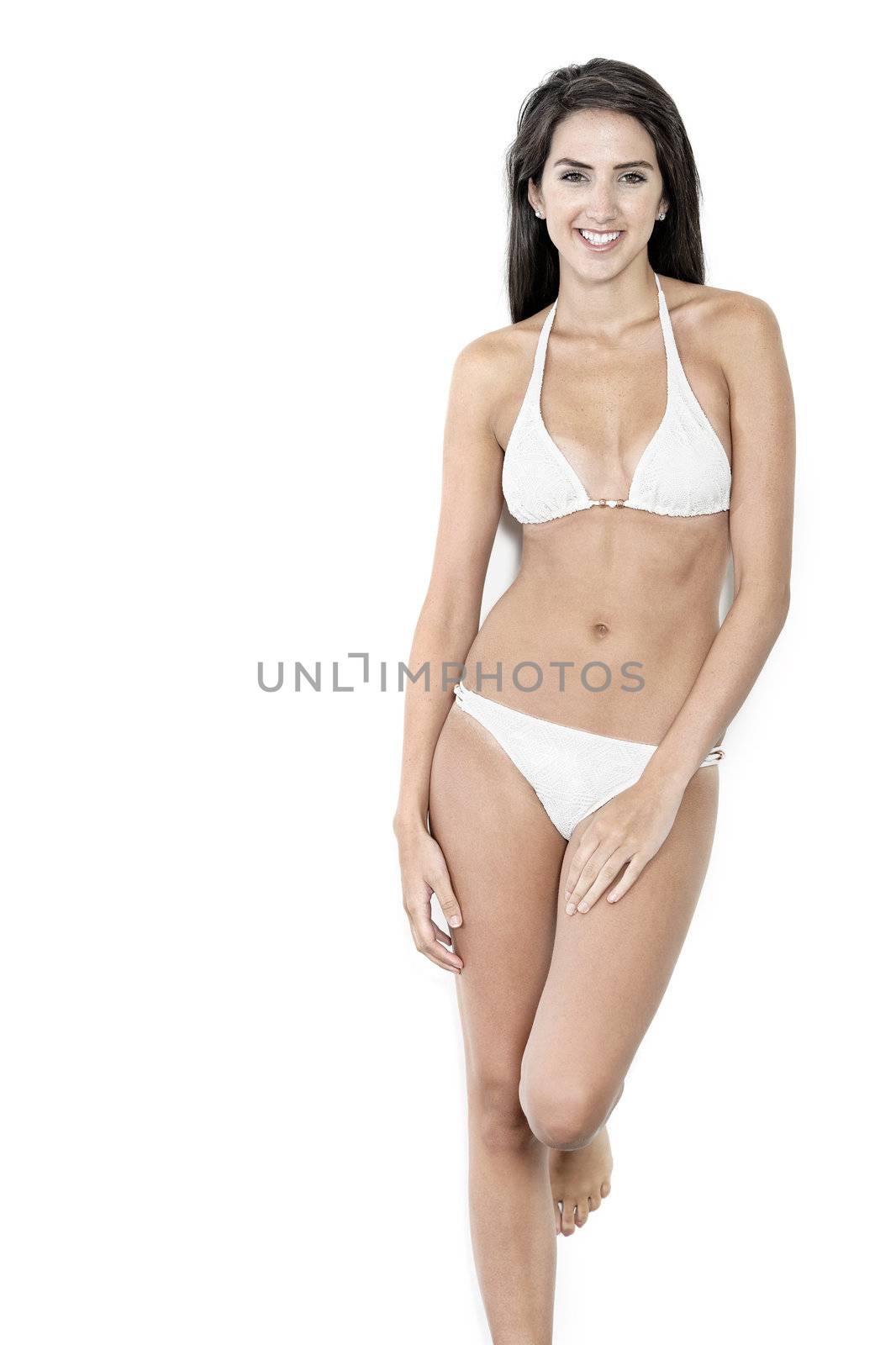 Beautiful sexy woman in white bikini smiling and cheerful