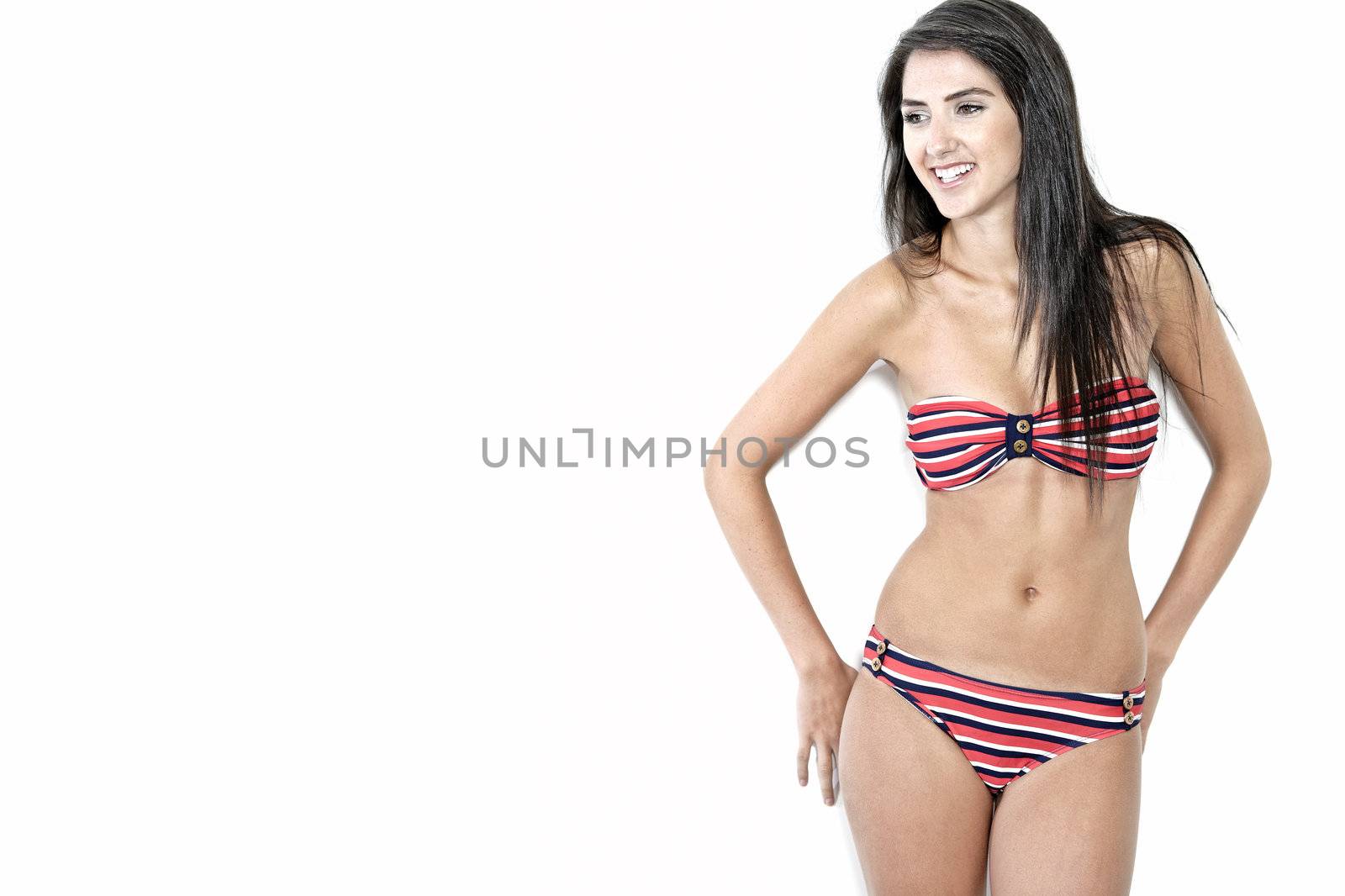 Woman in bikini smiling by studiofi