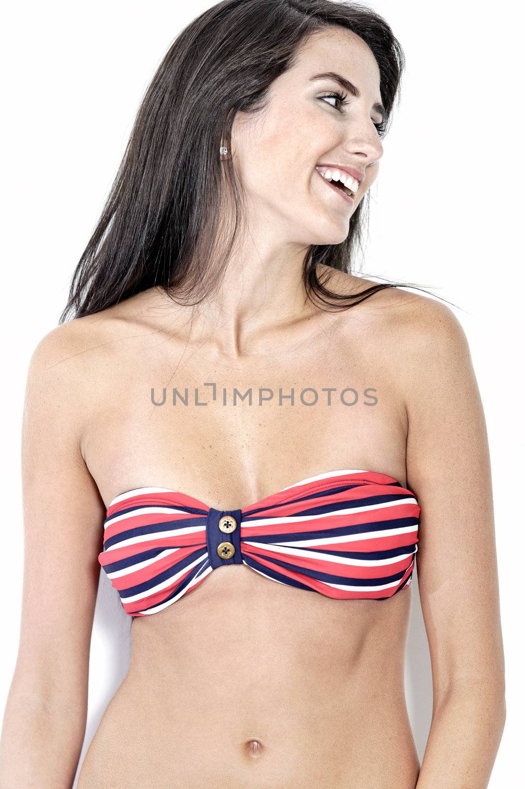 Beautiful sexy woman in red striped bikini smiling and cheerful