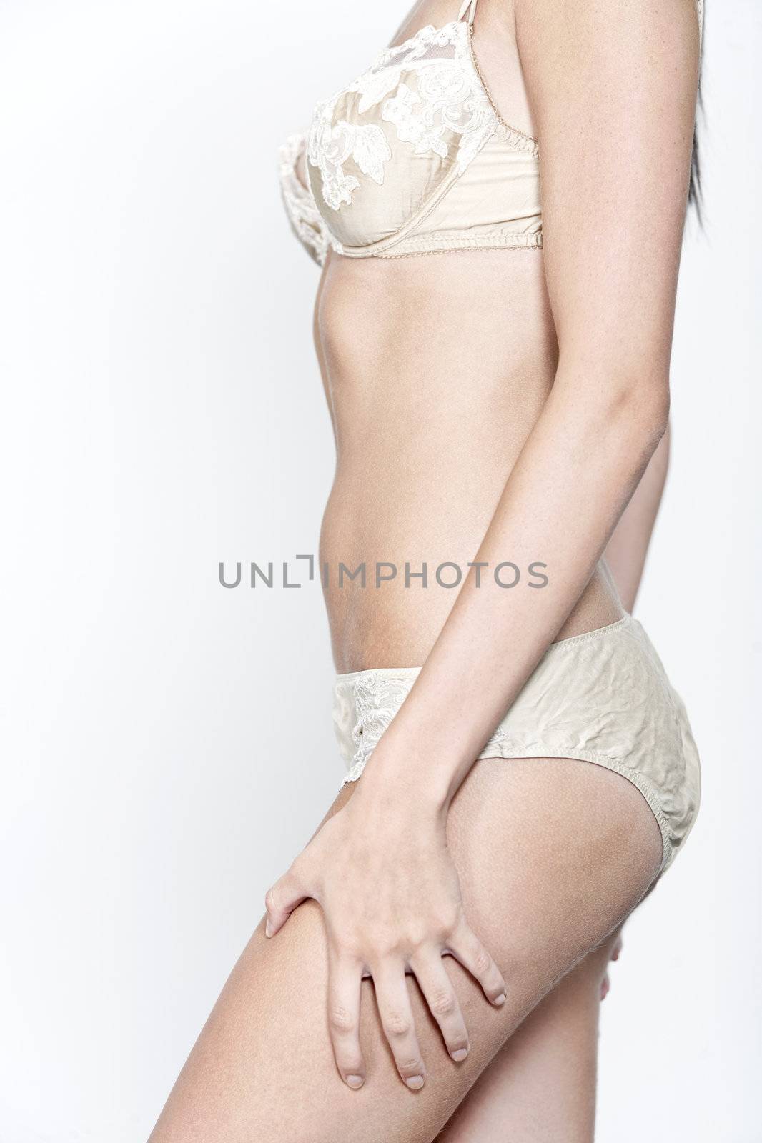 Woman in cream underwear by studiofi