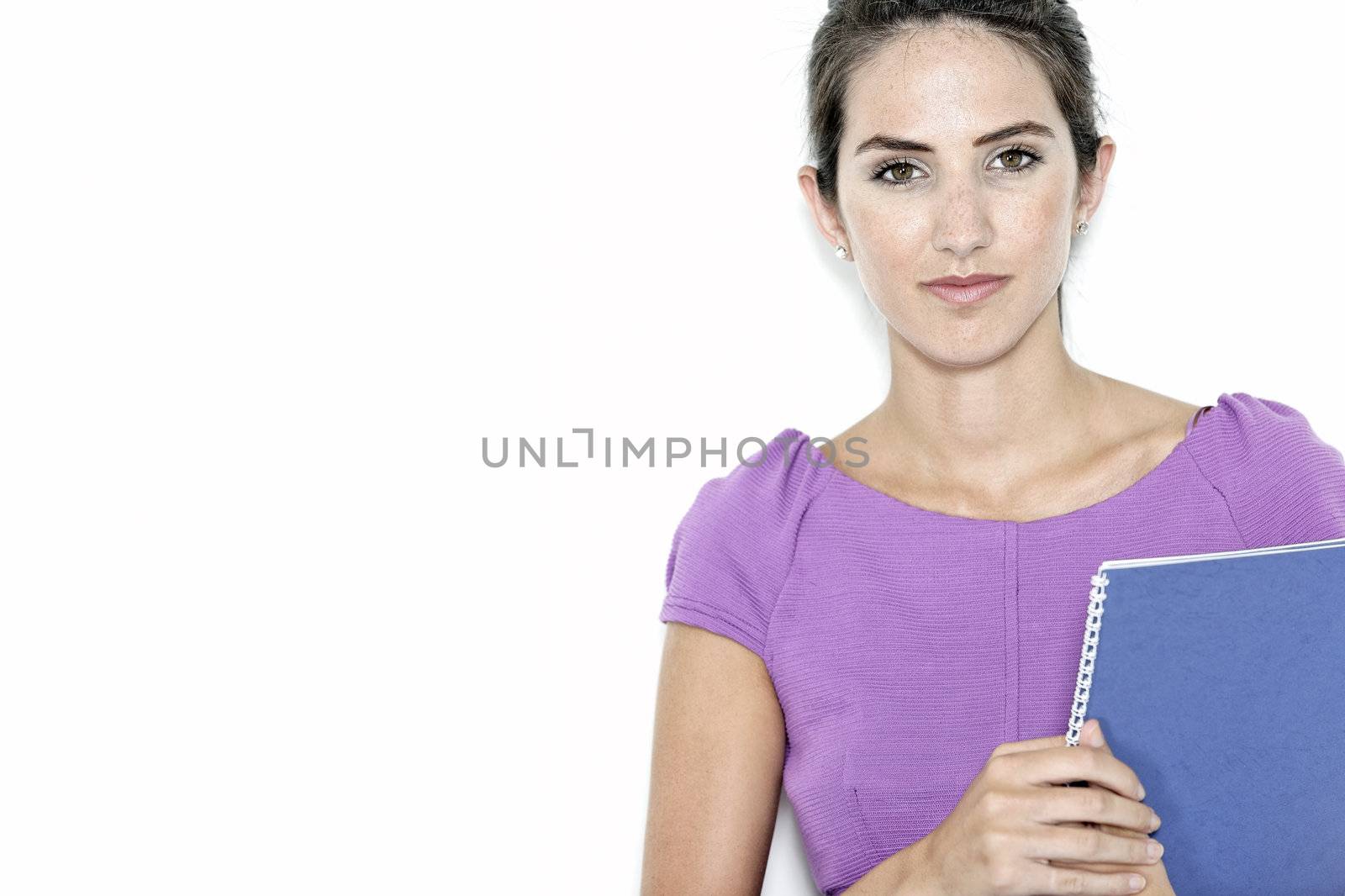 Professional business woman holding blue folders in a purple smart dress