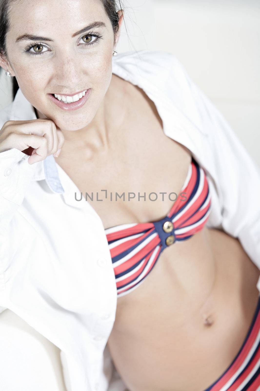 Woman in red bikini and white shirt by studiofi