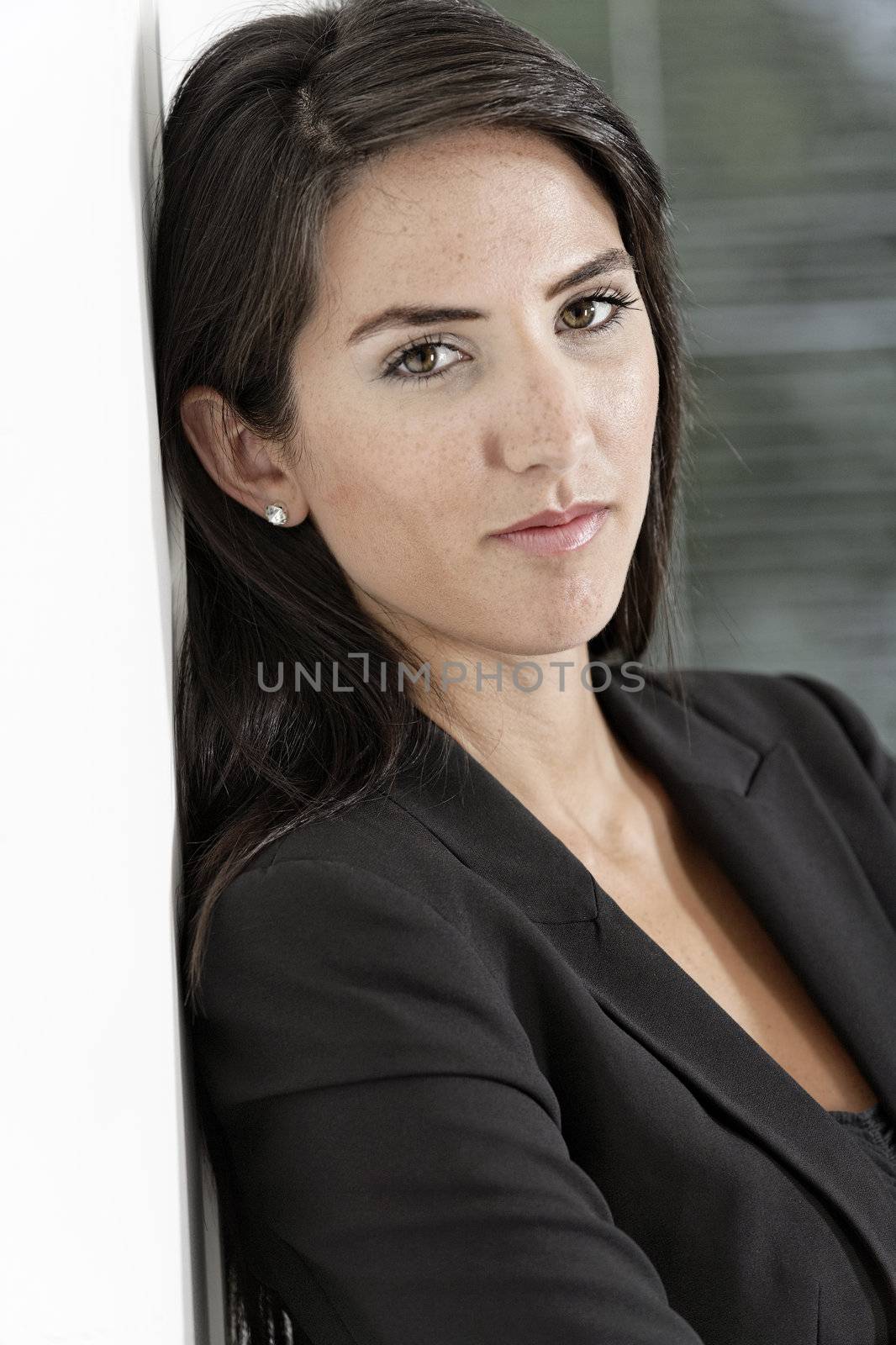 Woman in smart business suit by studiofi