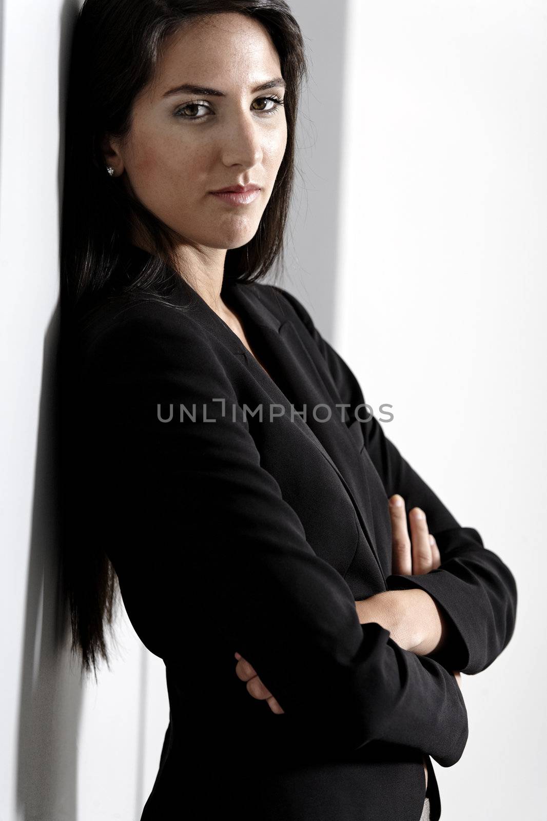 Woman in smart business suit by studiofi