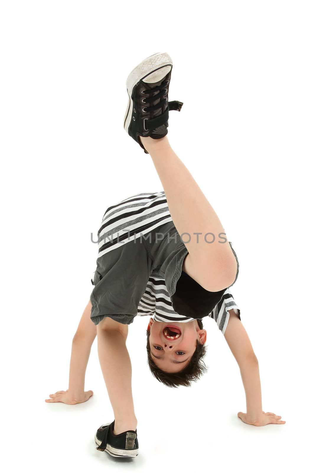 Boy Doing Cartwheel over White Background by duplass