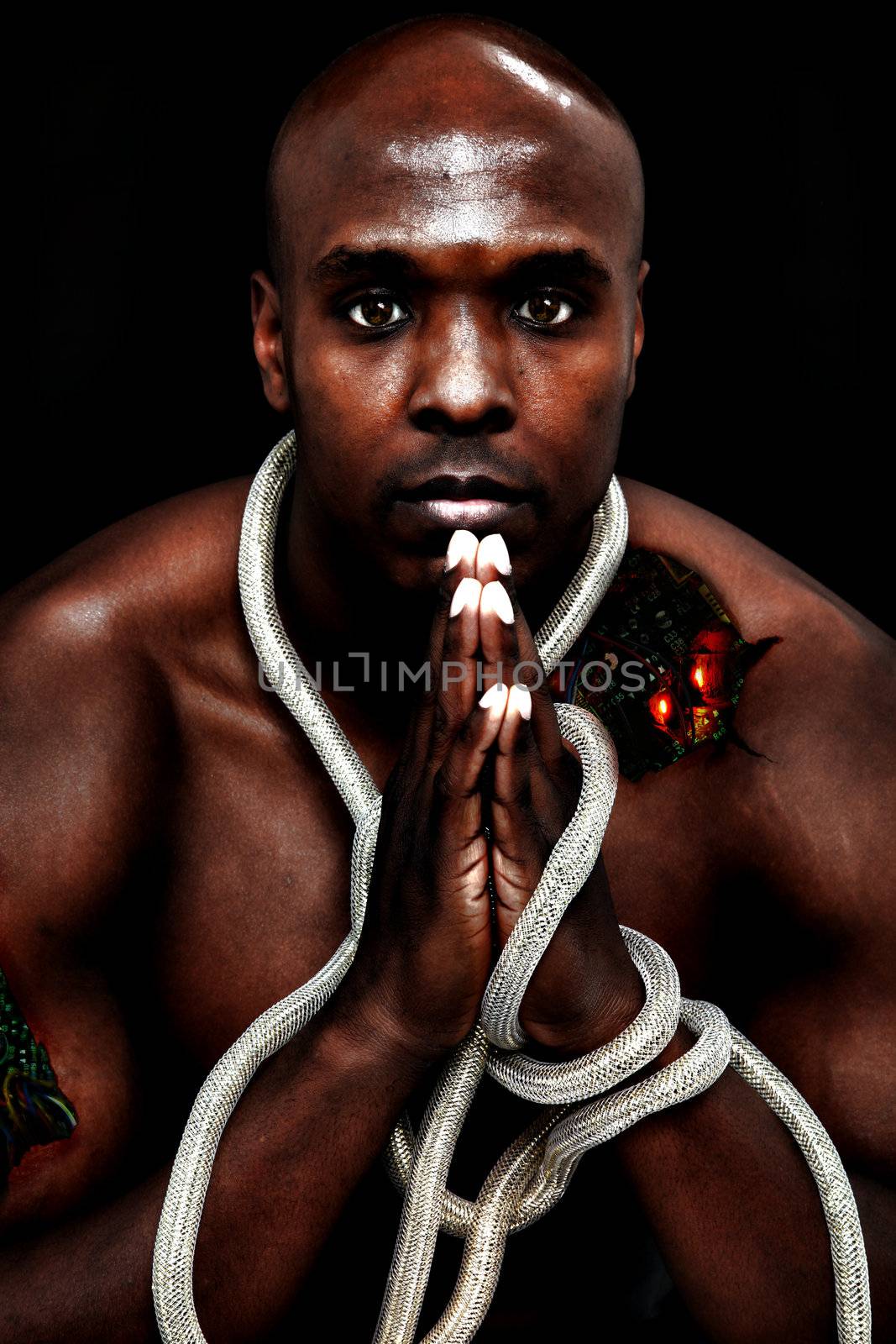 Attractive black man as damaged cyborg with wires and circuits exposed.