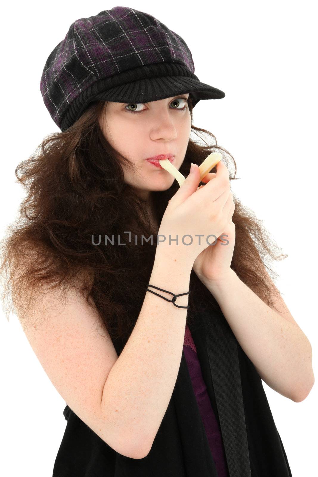 Attractive 18 year old girl in hat over white eating mozzarella  string cheese.