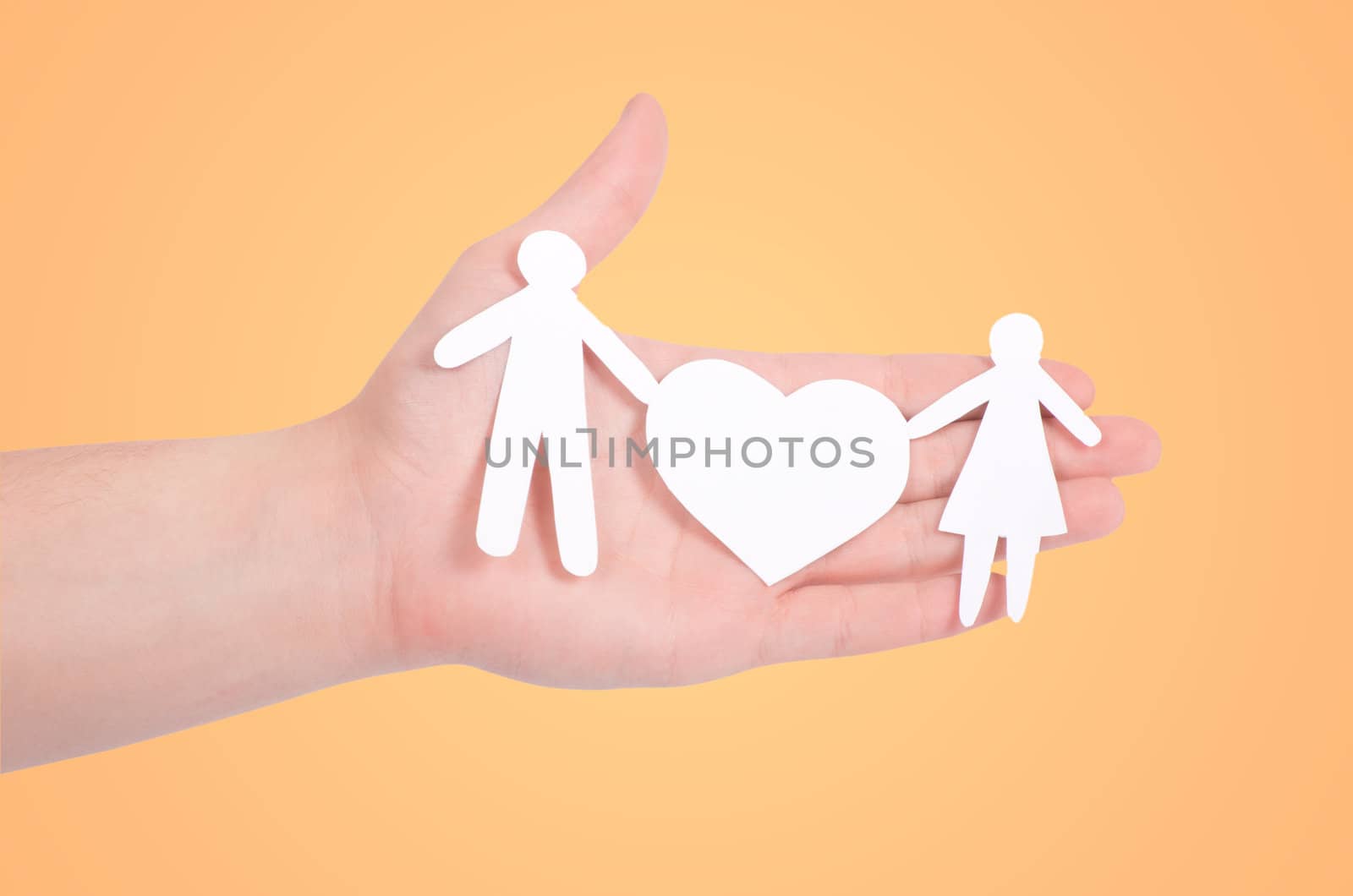 paper family in hands isolated on white