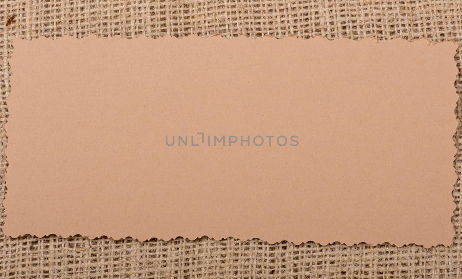 Old paper tag on natural burlap
