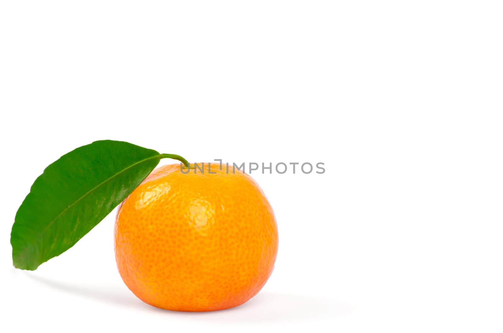 Tangerine with green leaves isolated on white