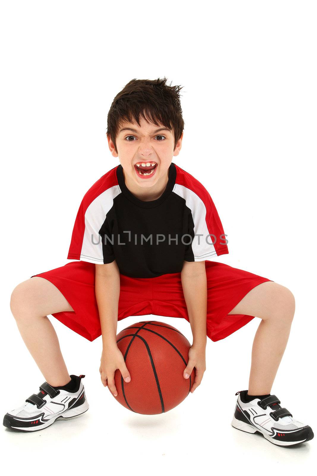 Team sport basketball player child with ball making crazy expressions.