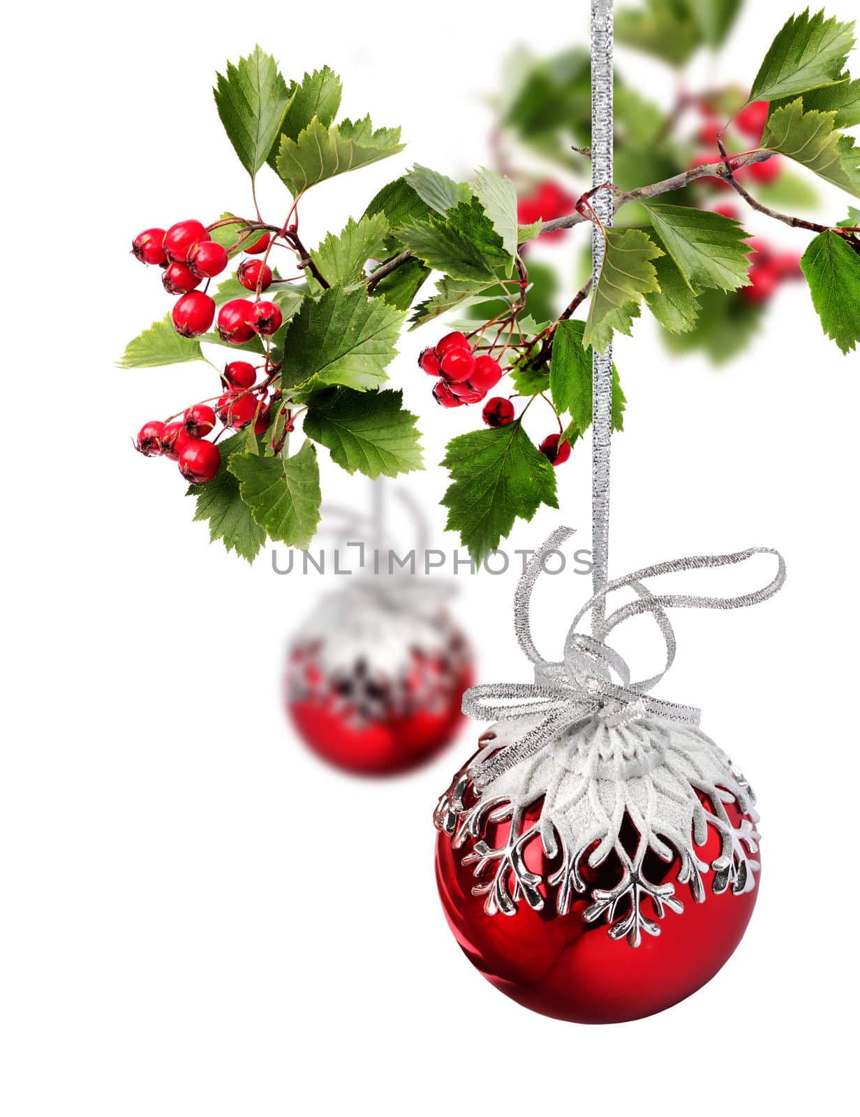 Red Christmas balls with hawthorn berries branch, isolated on white