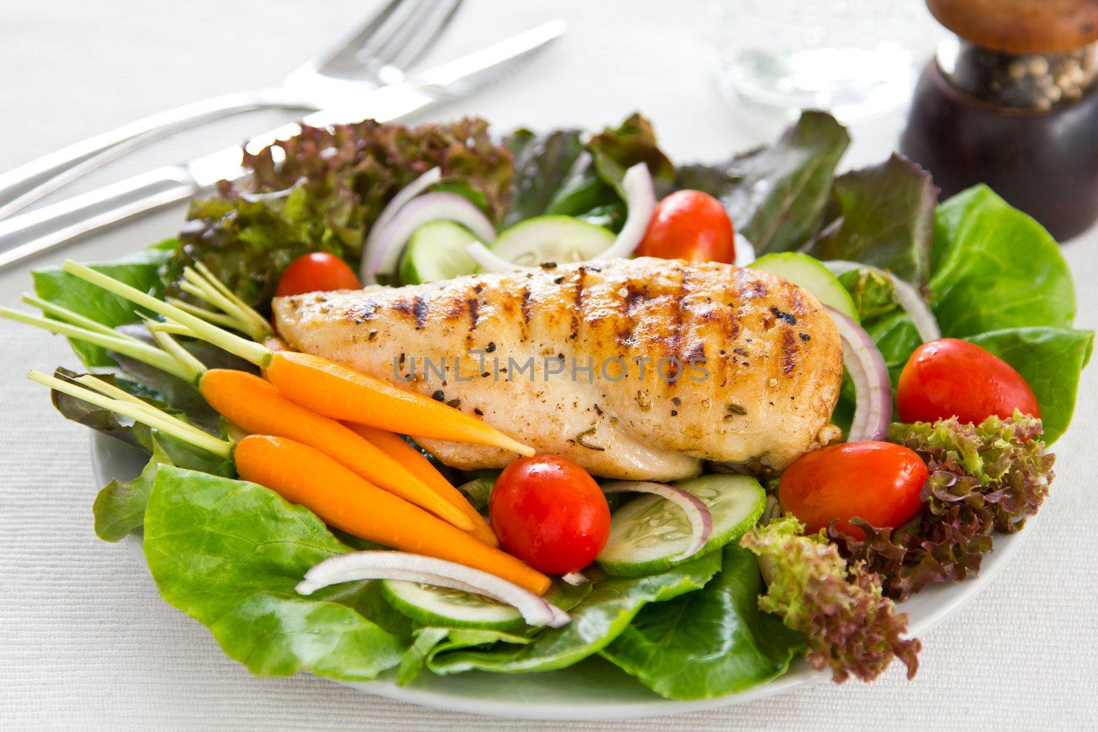 Grilled chicken with lettuce,cherry tomato and baby carrot salad