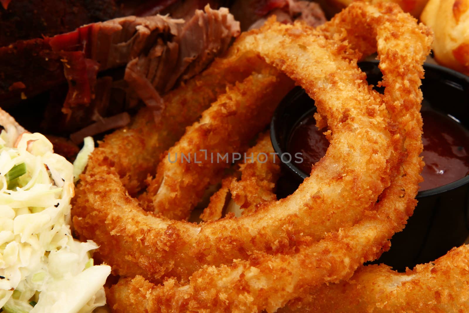 Close Up Onion Rings in Plate of Food by duplass