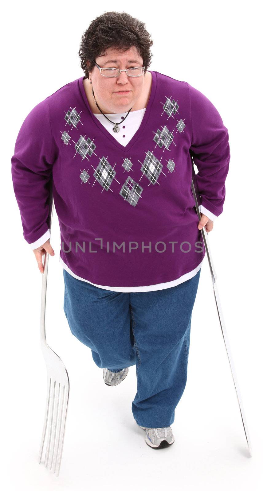 Food as Crutch Concept overweigth woman with giant knife and fork used as crutches.  Over white with clipping path.