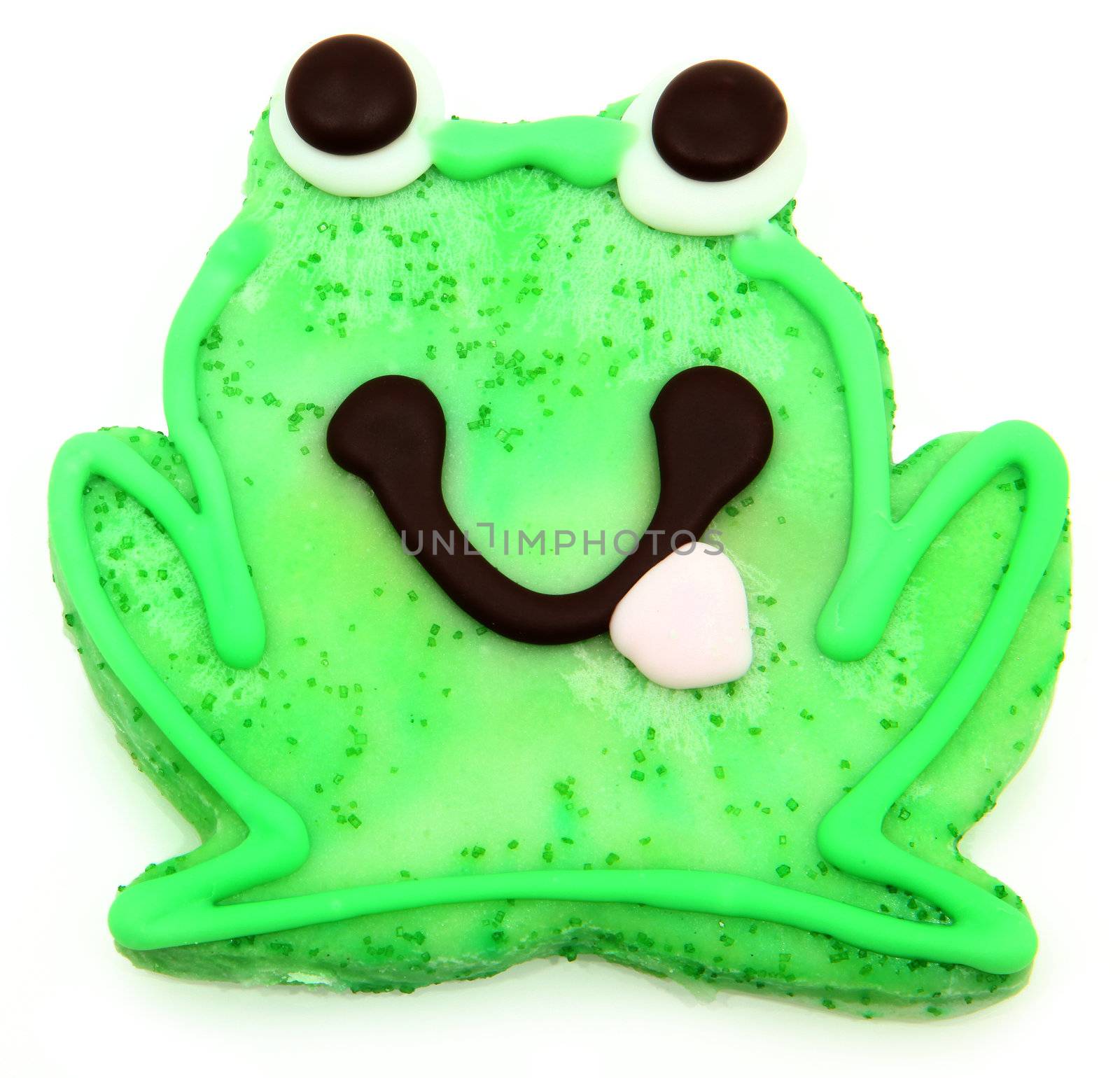 Green frog sugar cookie dessert over white background.