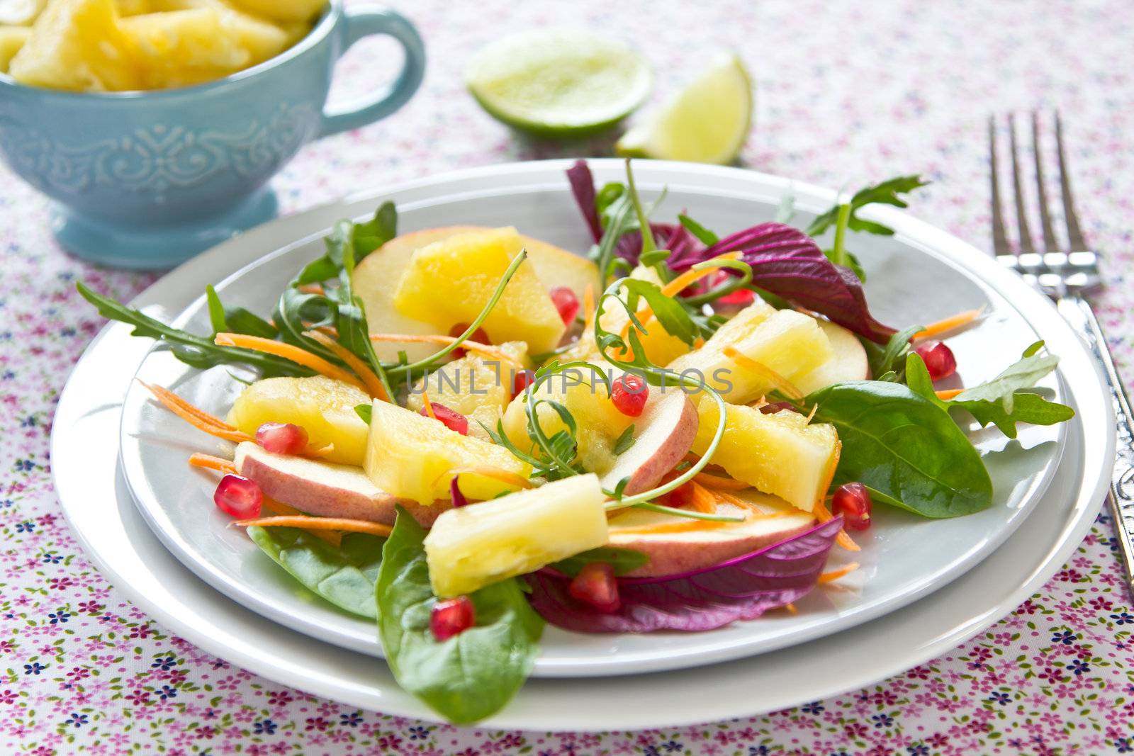 Pineapple with pomegranate and spinach salad