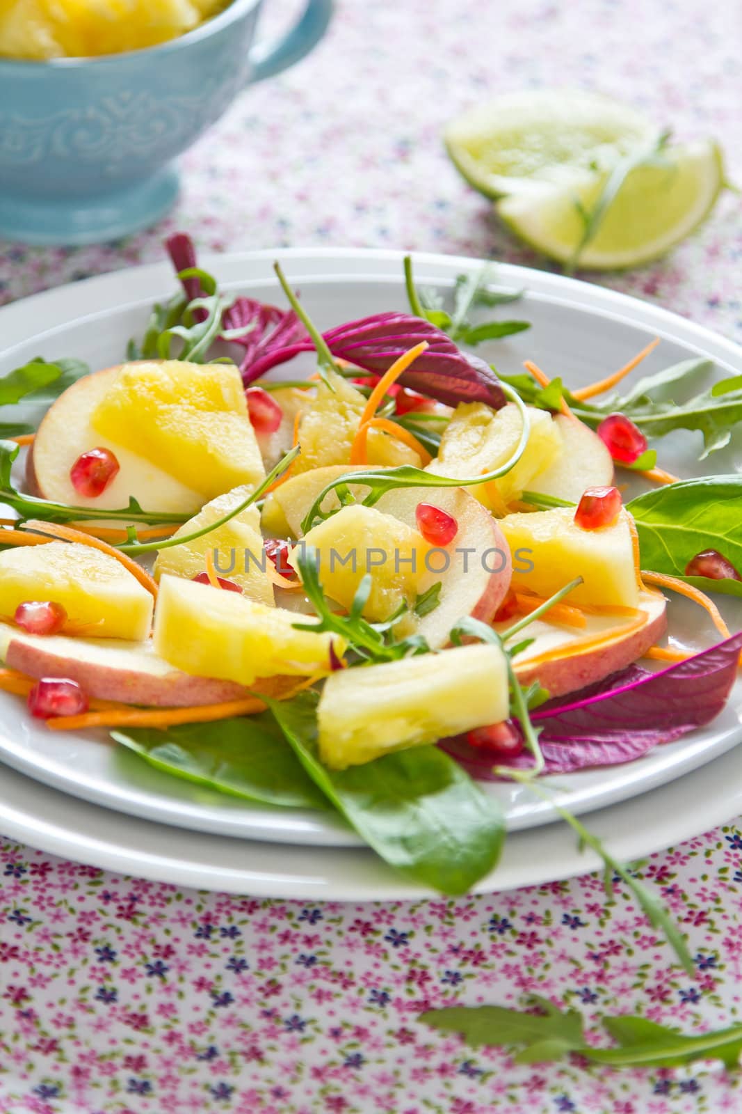 Pineapple with pomegranate and spinach salad