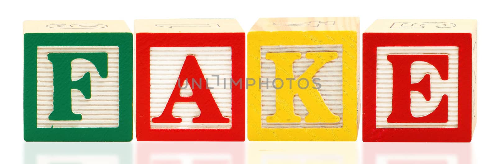 Colorful alphabet blocks spelling the word FAKE over white.