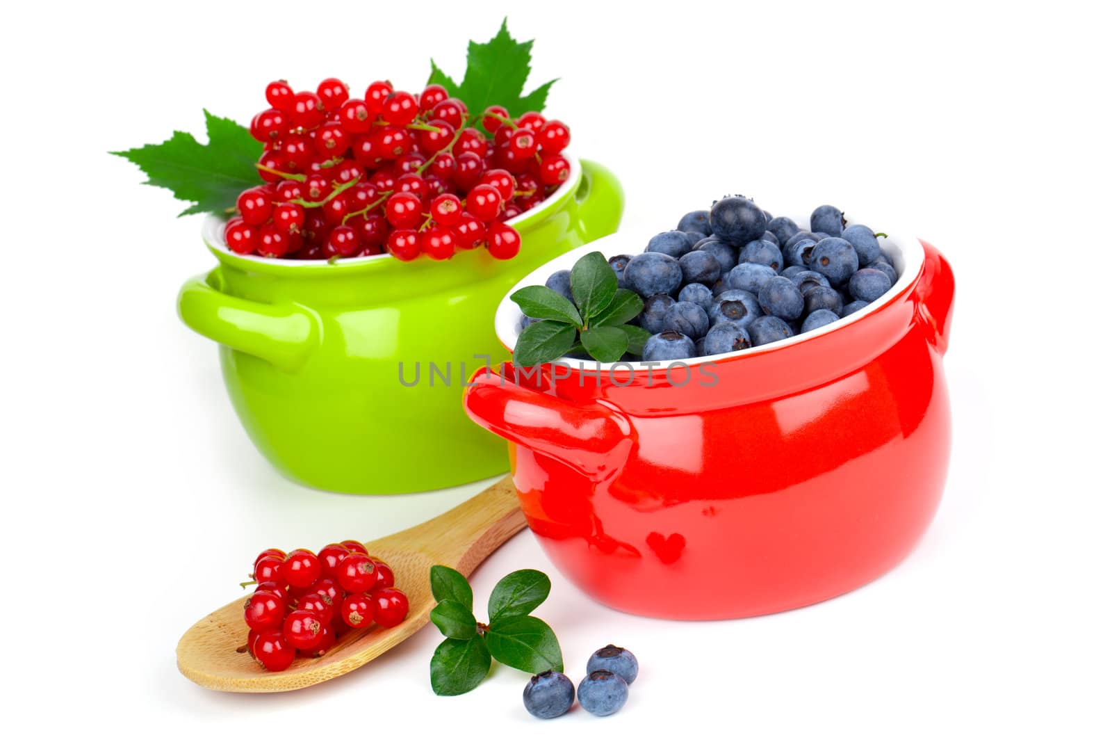 delicious red currant and blueberry, isolated on white background