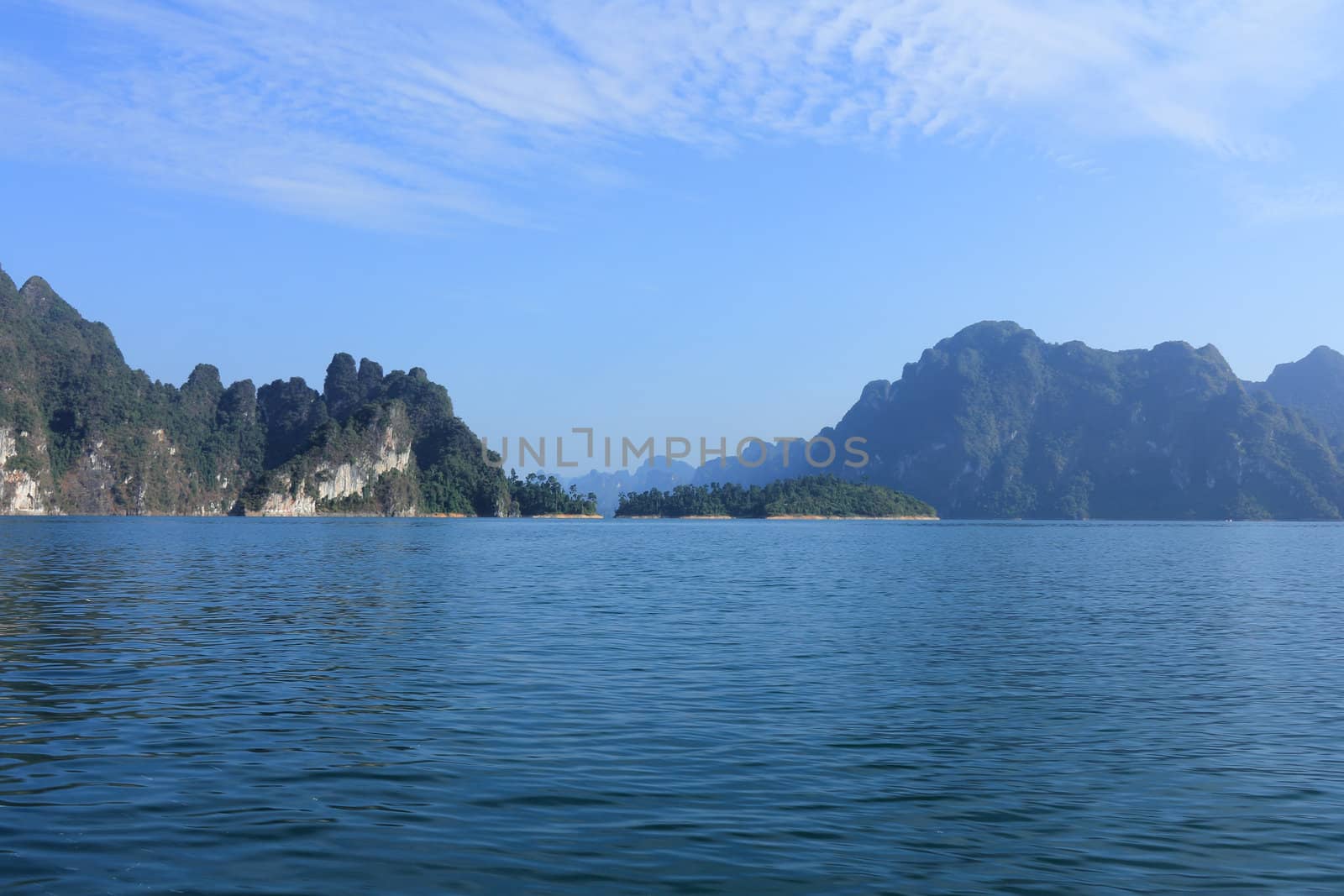 Cheow Larn Lake at Khao Sok National Park in Southern Thailand, beautiful view of mountains, hills, water