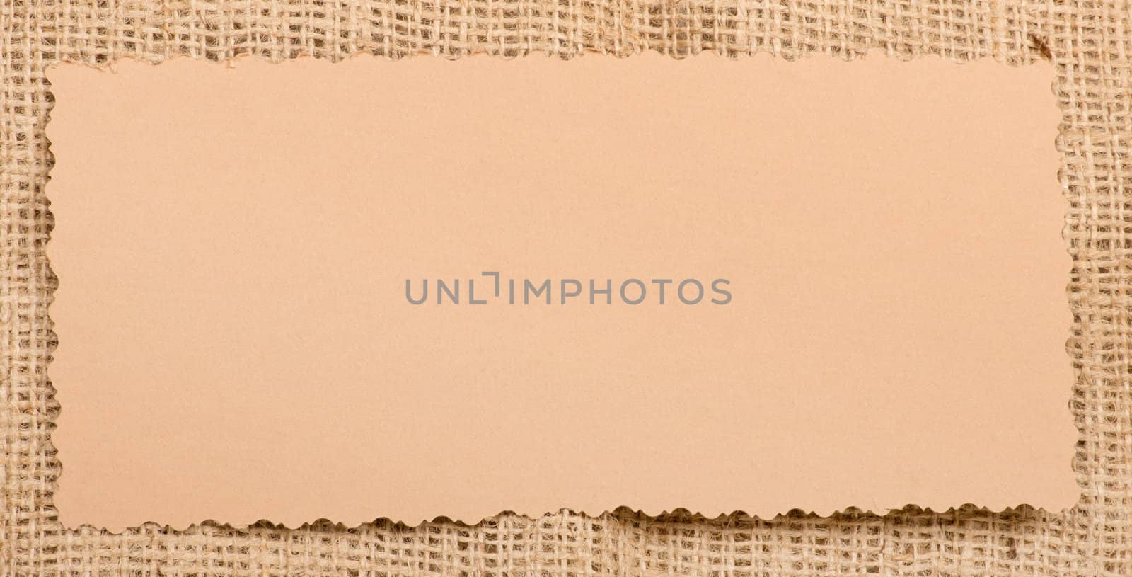 Old paper tag on natural burlap
