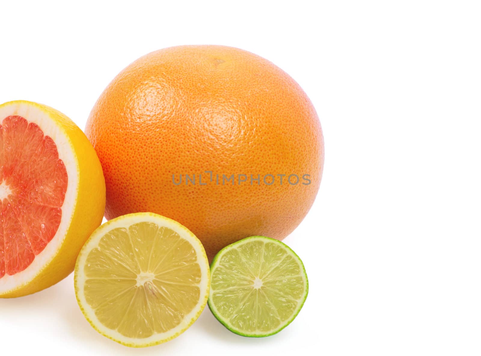 Image of a fresh whole lime, lemon and orange isolated on white