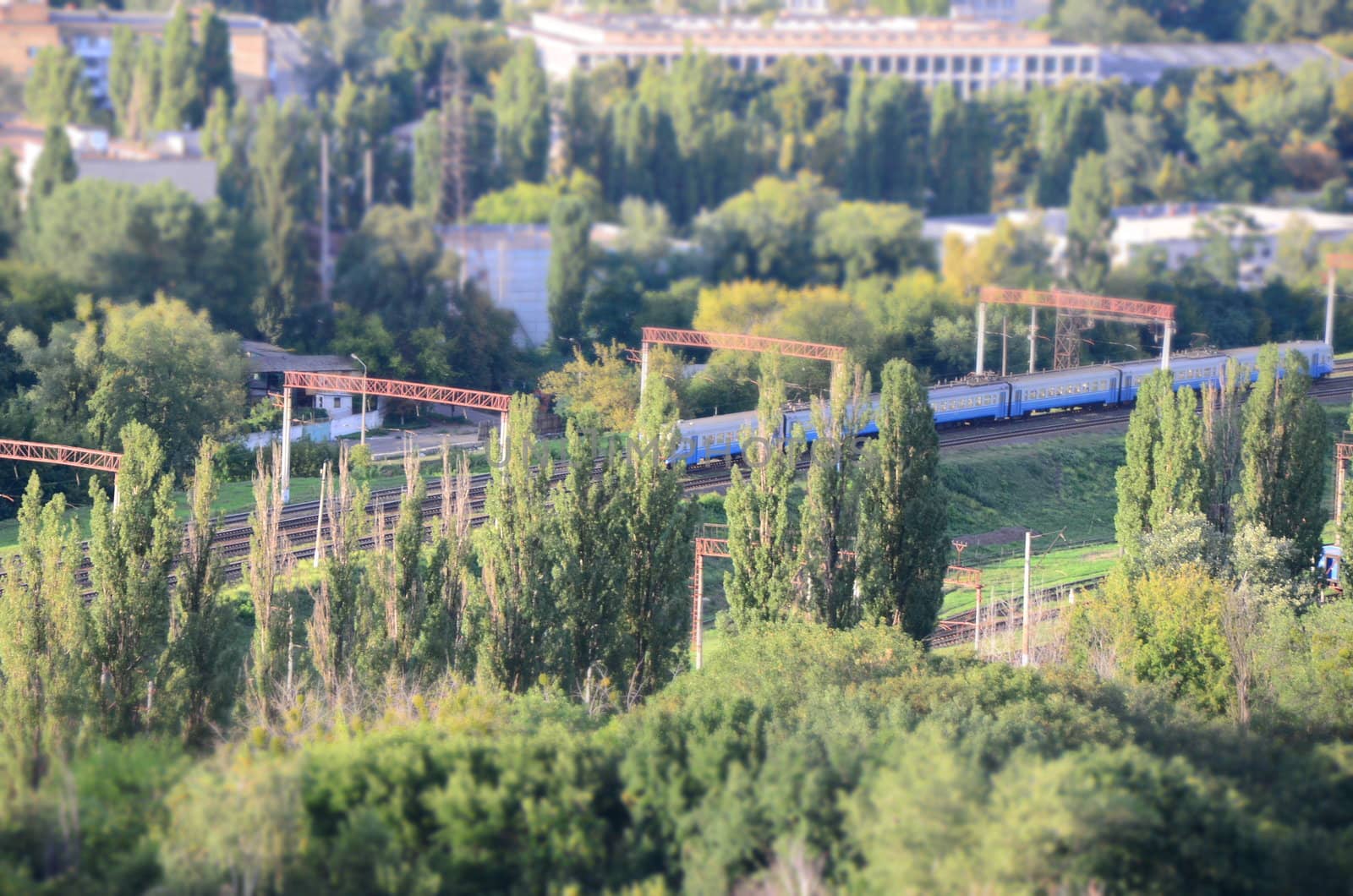 Blue train near green park at Kiev, Ukraine