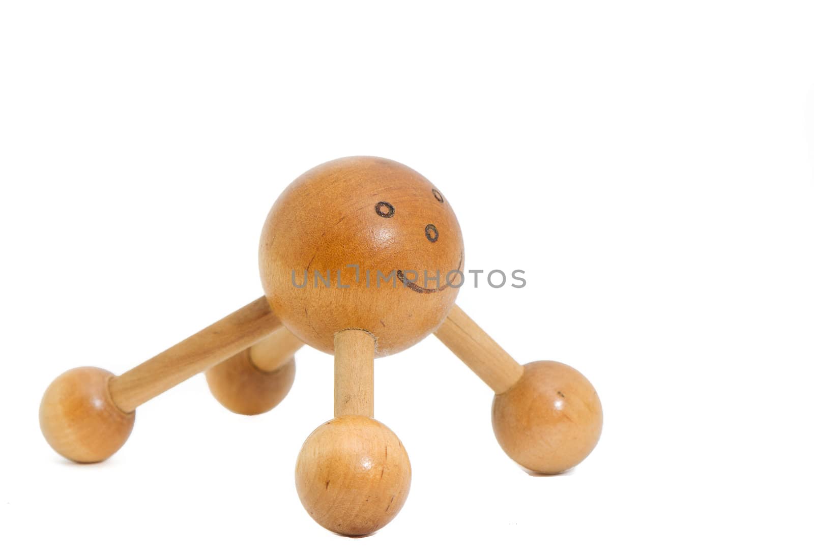 a smiley wooden massager for the back