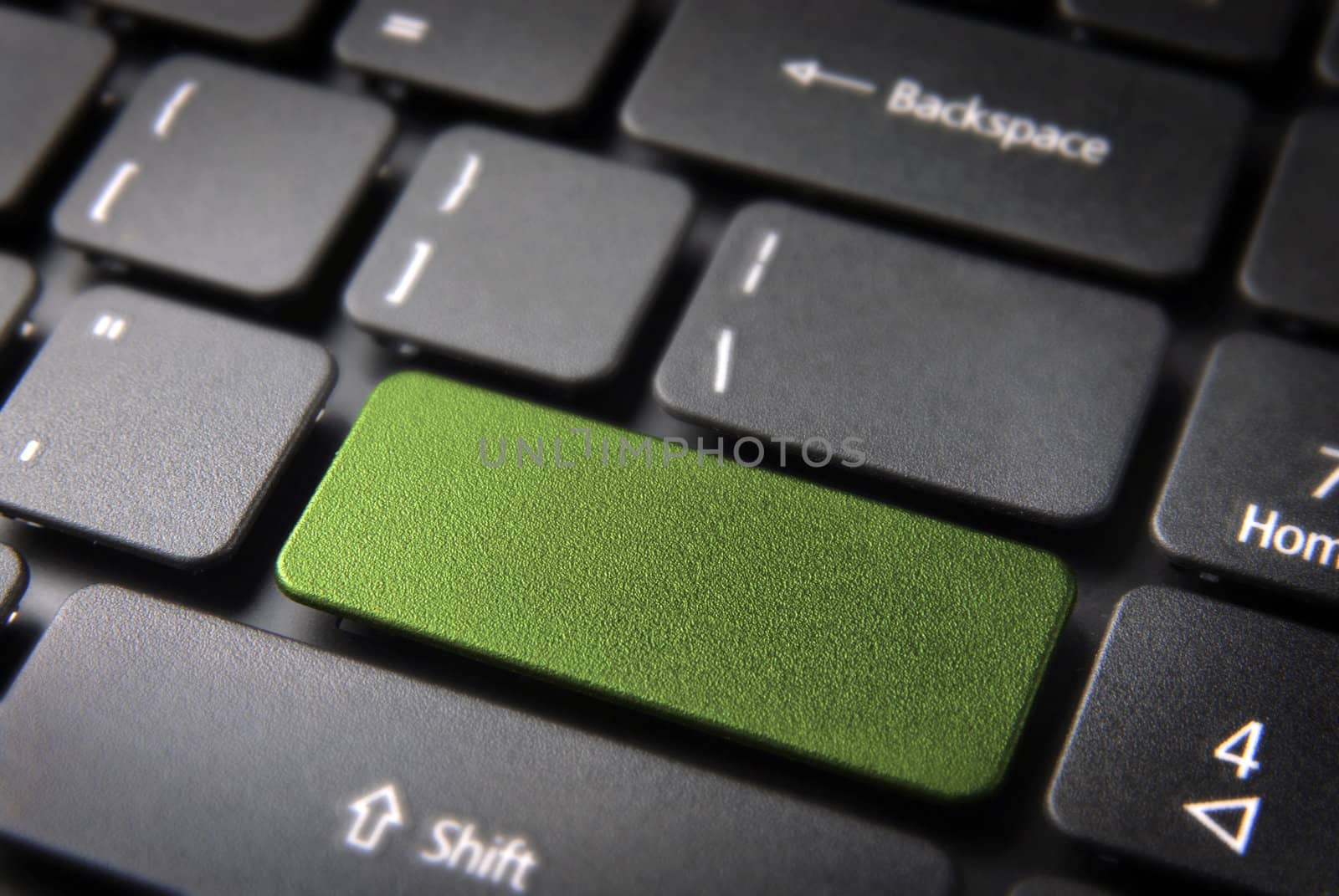 Green key on laptop keyboard with blank space. Included clipping path, so you can easily edit it and include your own color, text or icon.