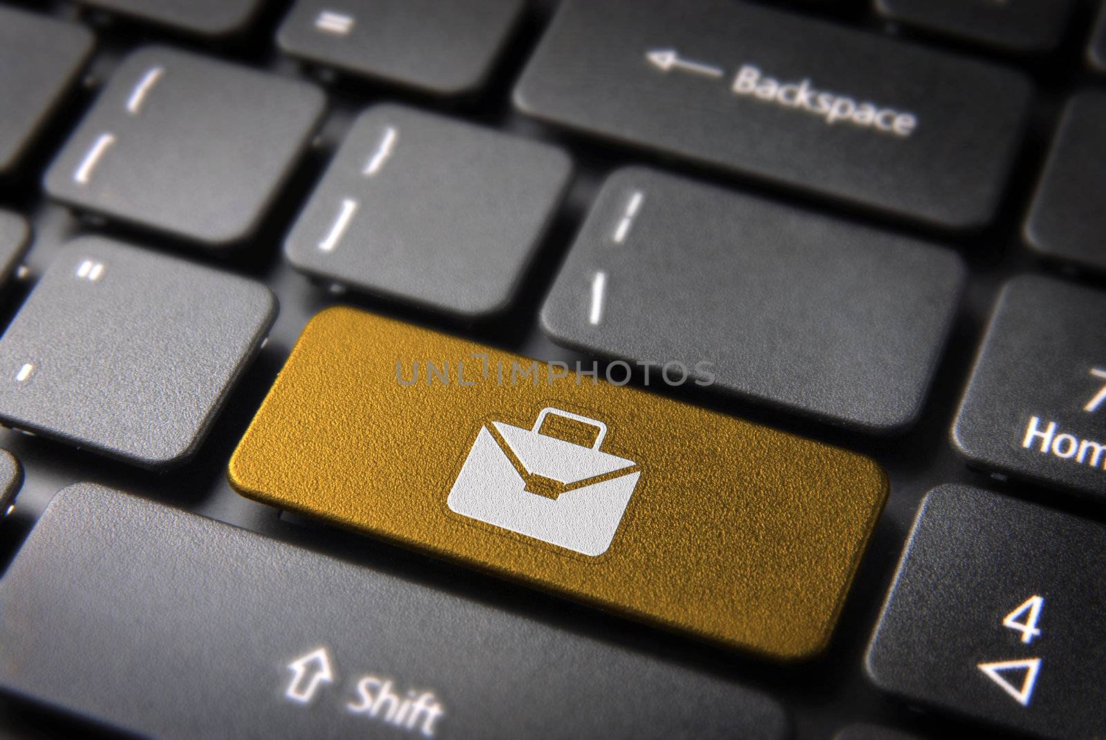 Professional business online key with portfolio icon on laptop keyboard. Included clipping path, so you can easily edit it.